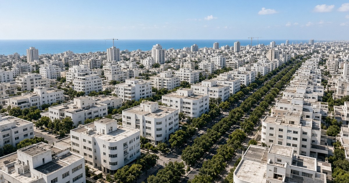 מבט אווירי על בניינים לבנים במרכז תל אביב ועגורני בנייה – תוכנית רובעים 5-6 למוכרים ולקונים